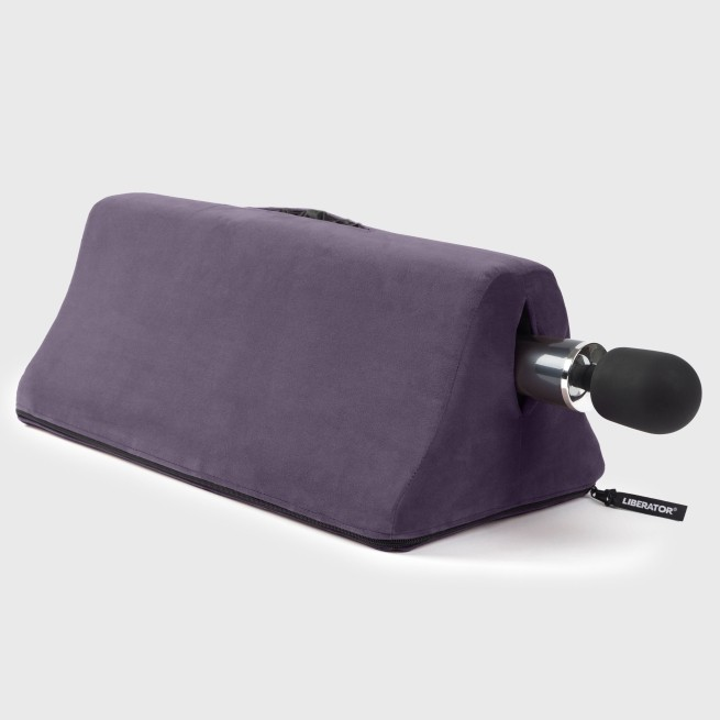 Tula Toy Mount with wand vibrator by Liberator shown in purple microfiber. Compact shape designed for hands-free positioning and comfort.