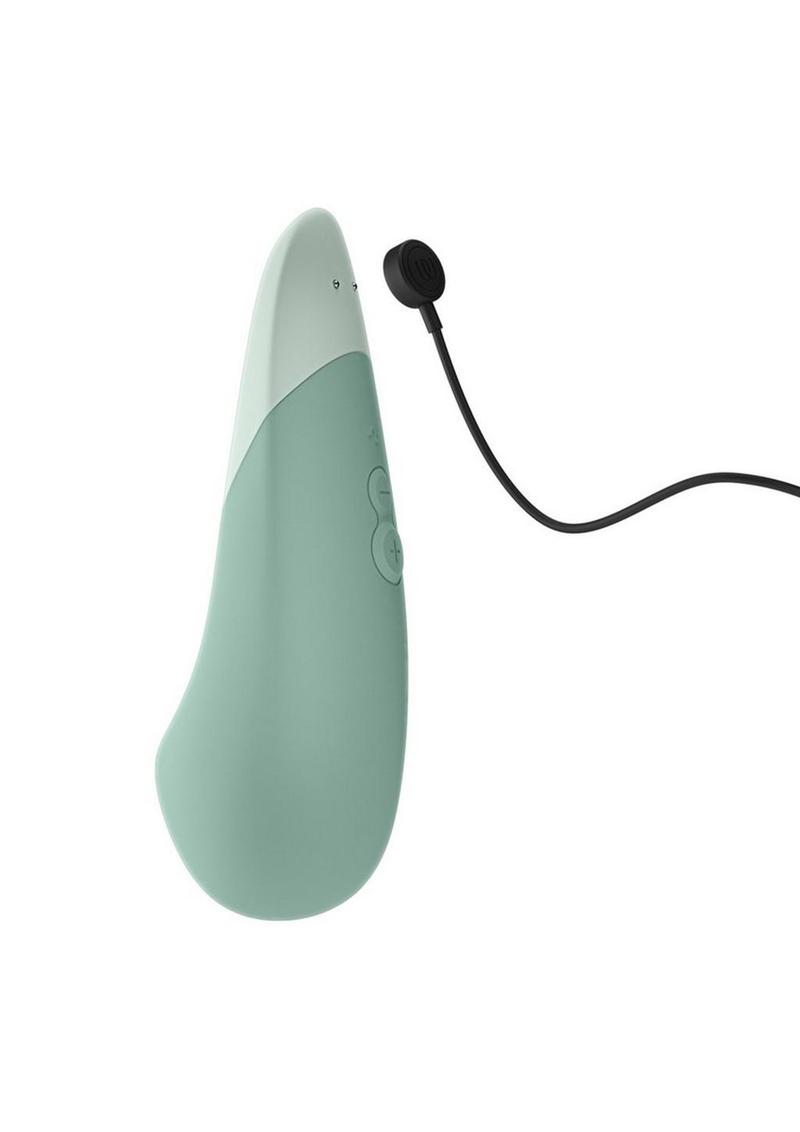 Mint green electronic device with a black cable on a white background